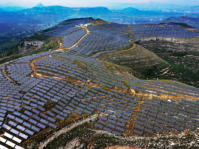 Photovoltaic and wind power stations on barren hills in shanting district, Zaozhuang, Shandong, China; Shutterstock ID 1633050535; purchase_order: Content Studio; job: ; client: ; other: 